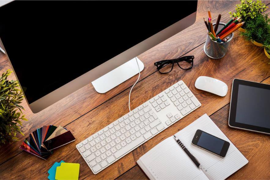 desktop computer workplace with stationery and dev 2026 03 19 07 03 11 utc